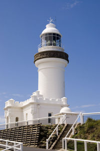 Low angle view of lighthouse against clear blue sky