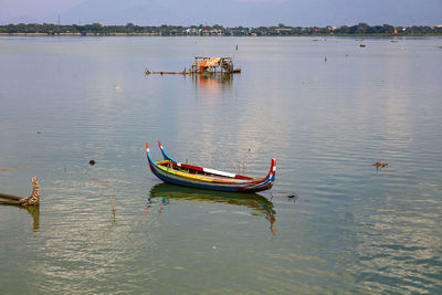 Boat moored in lake