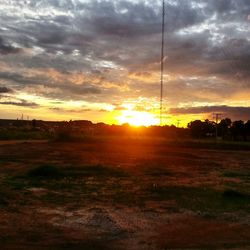 Scenic view of landscape against cloudy sky