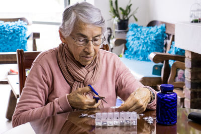 Portrait of woman sitting on table