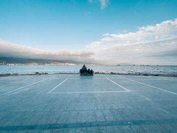 Scenic view of sea against cloudy sky