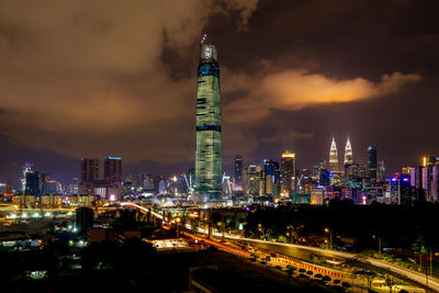 Illuminated buildings in city at night