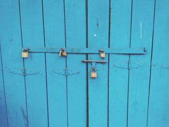 Locks on blue wooden door