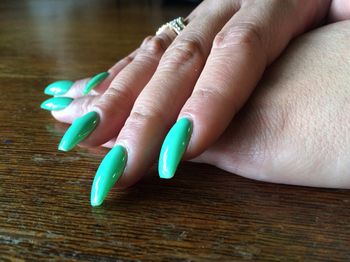 Close-up of woman hand on table