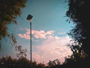 Low angle view of street light against sky during sunset
