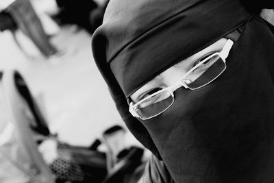 Close-up of woman wearing burkha and eyeglasses