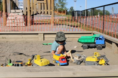 Portrait of boy playing with toy car