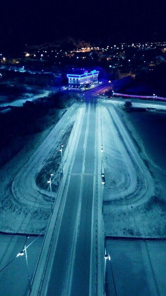 AERIAL VIEW OF ILLUMINATED CITY