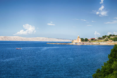 Scenic view of sea against blue sky