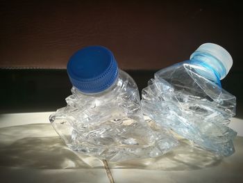 Close-up of glass bottle on table