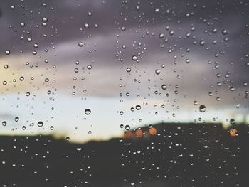 Full frame shot of raindrops on glass window