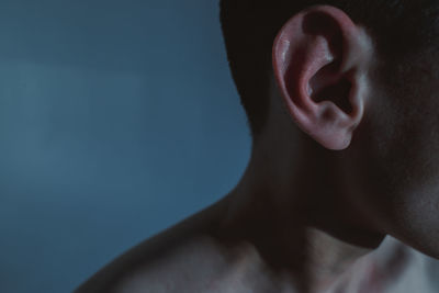 Close-up portrait of shirtless man