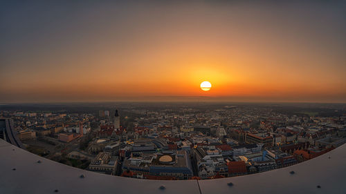 High angle view of city buildings during sunset