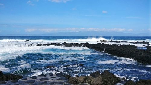 Scenic view of sea against clear blue sky