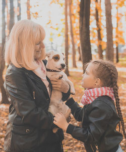 Rear view of woman with dog