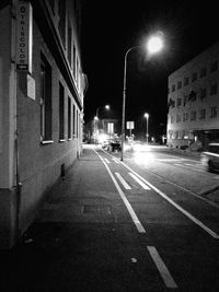 Illuminated street at night