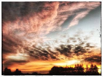 Scenic view of dramatic sky during sunset