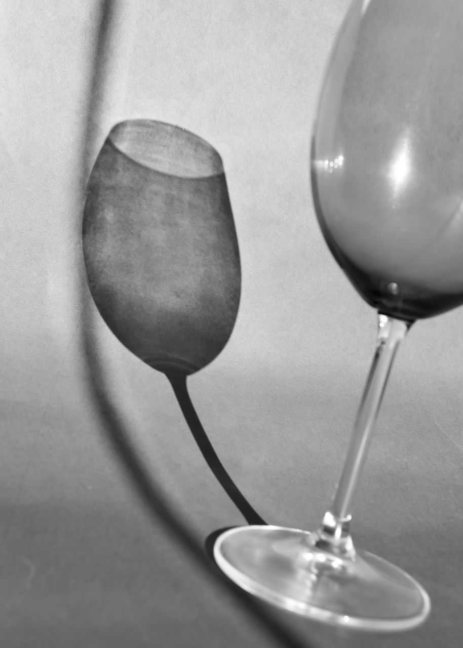 wine glass, still life photography, stemware, glass, tableware, food and drink, indoors, black and white, household equipment, no people, close-up, champagne stemware, drinkware, still life, monochrome photography, wine, spoon, alcohol, refreshment, drink, studio shot, two objects, kitchen utensil, drinking glass