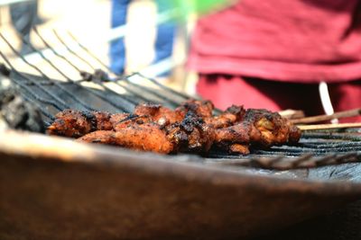 Close-up of meat on barbecue grill