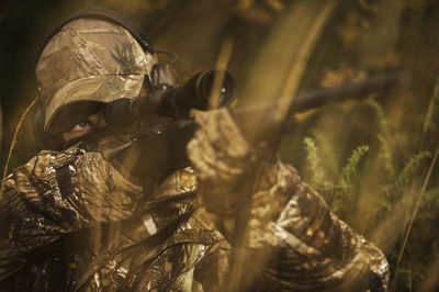 Teenage boy with rifle at hunting