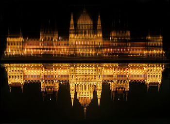 Reflection of illuminated built structure in water