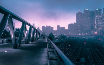 View of bridge in city against sky