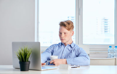 Businesswoman working at desk in office