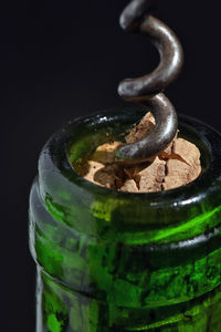 High angle view of beer bottle on black background