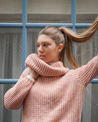 Portrait of young woman standing in winter