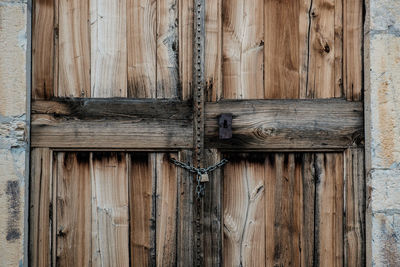 Old wooden door with padlock