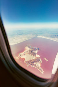 Low angle view of airplane wing against sky