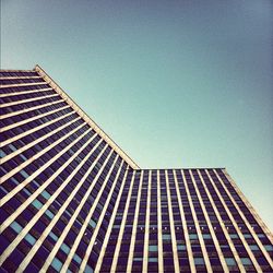 Low angle view of modern building against clear sky