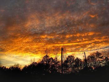 Low angle view of cloudy sky at sunset