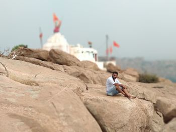 Man sitting on rock