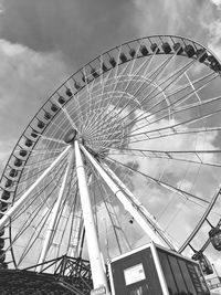 Low angle view of ferris wheel against sky