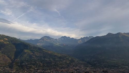 Scenic view of mountains against sky at night