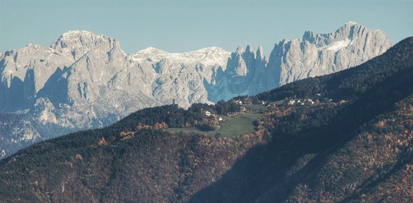 Scenic view of rocky mountains against clear sky