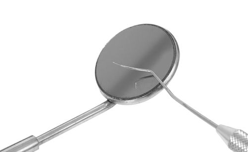 Low angle view of electric lamp against white background