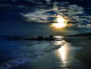 Scenic view of sea at sunset