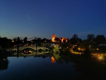 Reflection of illuminated buildings in water