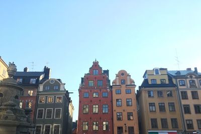 Low angle view of buildings against clear sky