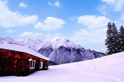 Scenic view of snow covered mountains against sky