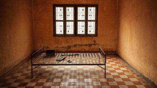 Empty table and window in old building