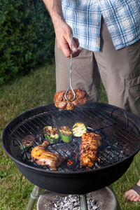 Midsection of man preparing food