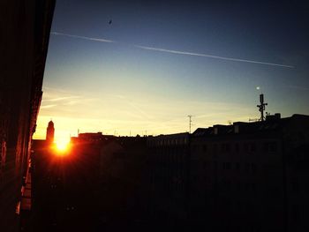 Low angle view of building against sky at sunset