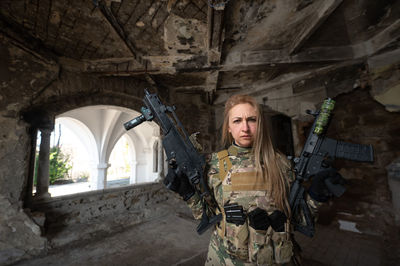 Portrait of young woman standing in tunnel