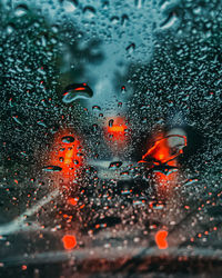 Raindrops on glass window during rainy season