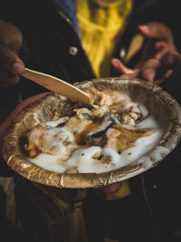 Close-up of hand holding ice cream