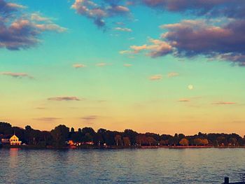 Scenic view of lake against sky during sunset