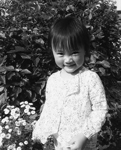 Portrait of cute girl standing outdoors